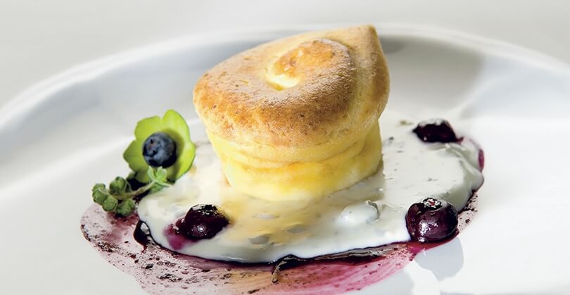 Gorgonzola flan with mustard and spicy blueberries