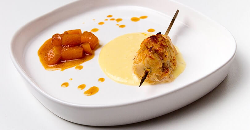Small chicken skewer marinated with fondue of mild Gorgonzola and melon