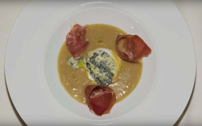 Drowned egg in a soup of bread, spicy Gorgonzola PDO and Serrano ham - Gorgonzola DOP