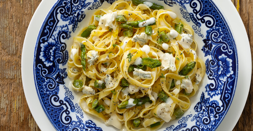 Tagliatelle with sweet gorgonzola pdo, asparagus, poppy seeds and herbs