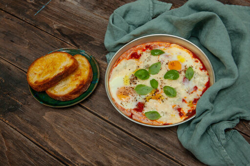 Baked Eggs with Gorgonzola PDO, Tomato and Toast