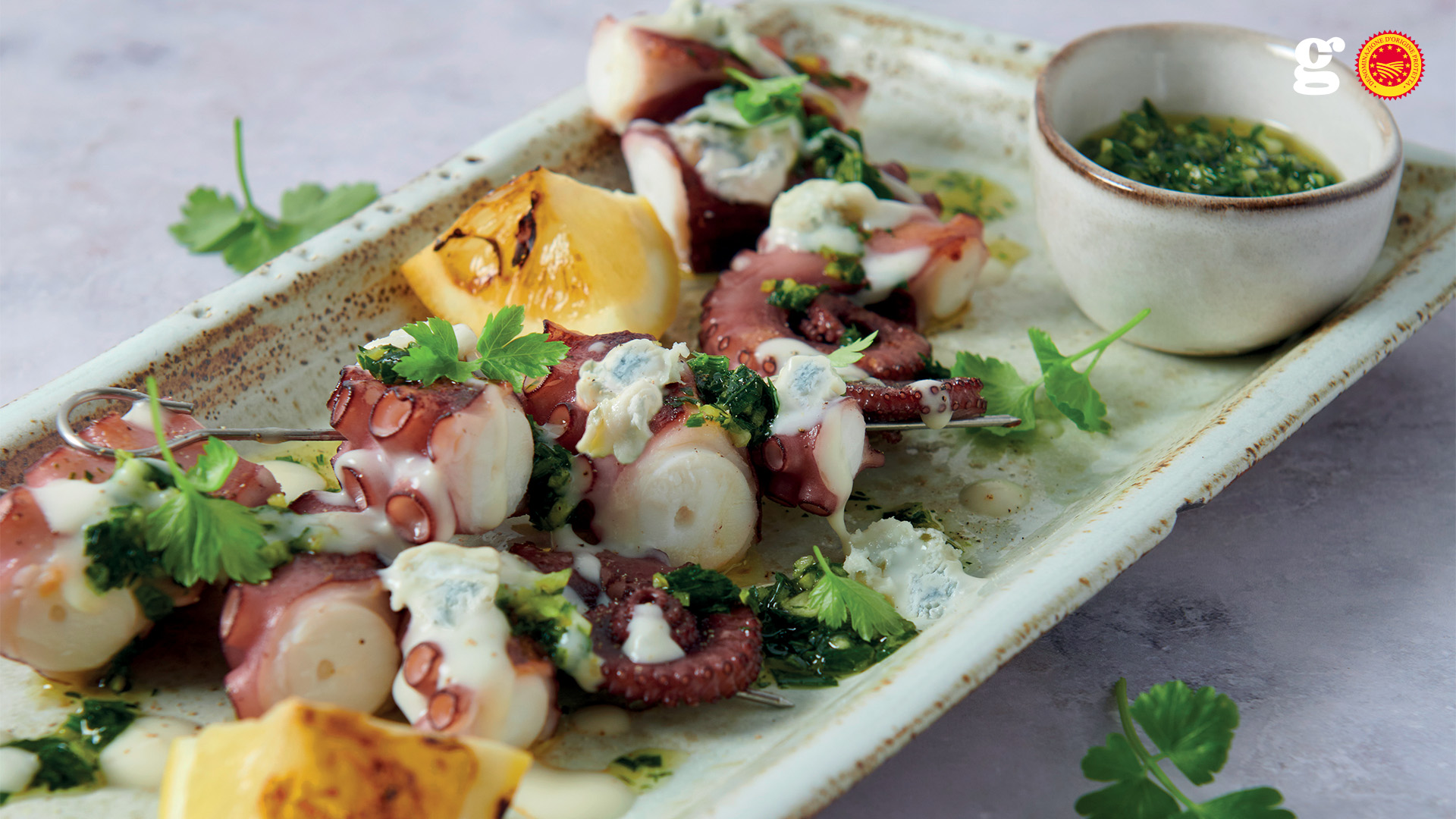 Octopus skewers and Gorgonzola PDO sauce and gremolada - Gorgonzola DOP